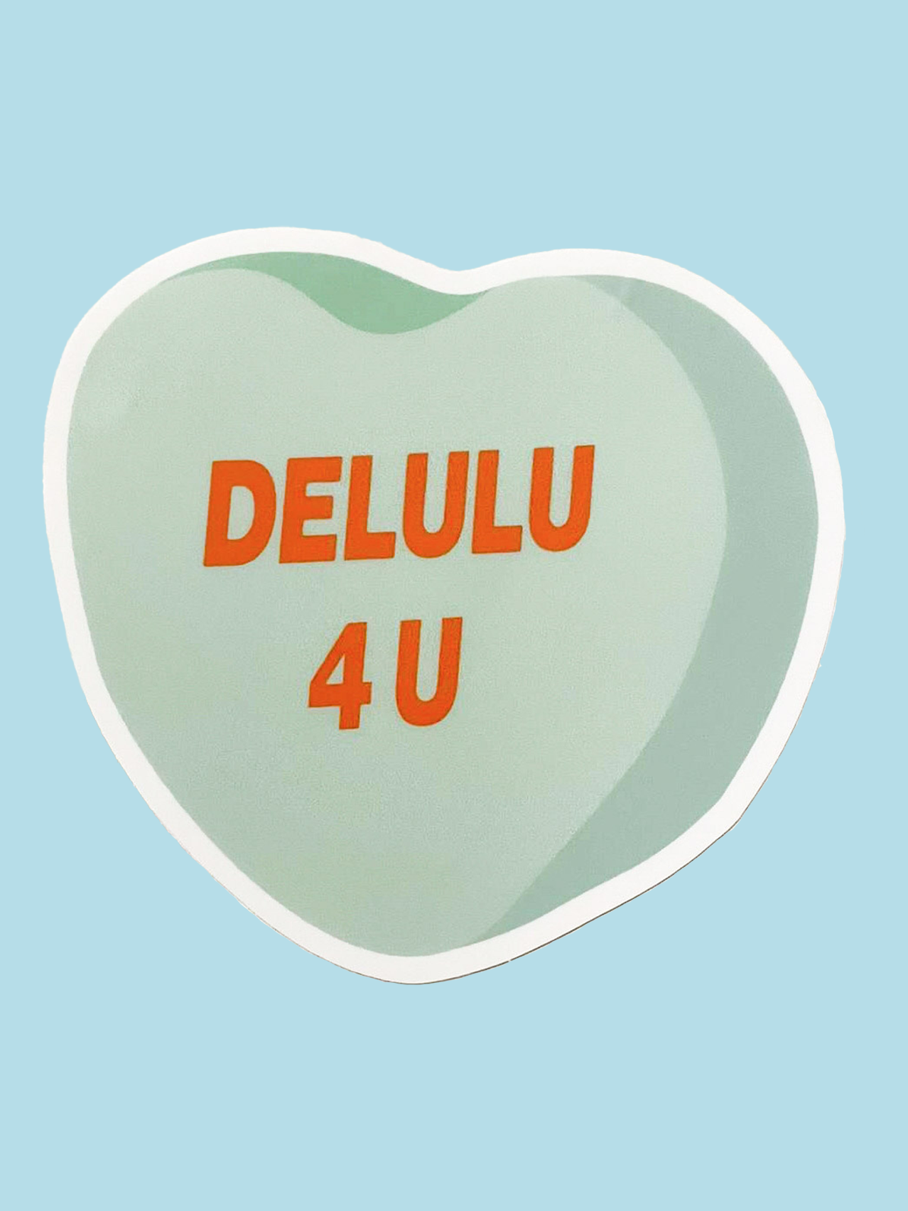 Green conversation heart sticker with orange text that reads "DELULU 4 U"